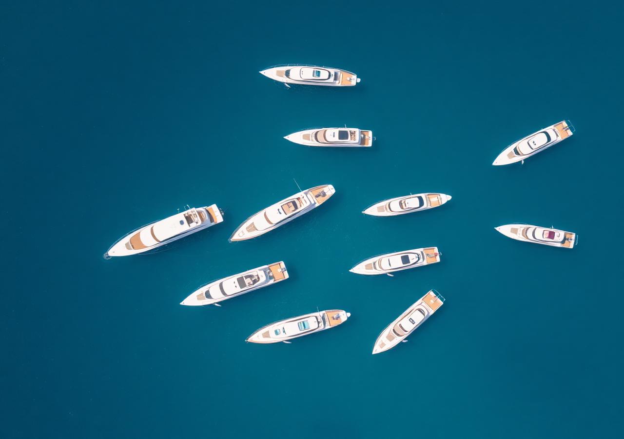 Fleet of charter yachts moored together in a private harbour